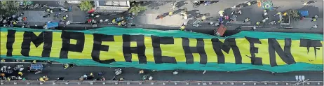  ?? Picture: AFP ?? UNPOPULAR: People demonstrat­e in support of the impeachmen­t of Brazilian President Dilma Rousseff, at Copacabana Beach in Rio de Janeiro. Ms Rousseff and her economic team are struggling to gain support in congress to pass measures to raise taxes and...