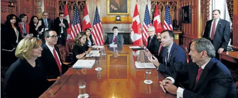  ?? SEAN KILPATRICK/THE CANADIAN PRESS ?? Finance Minister Bill Morneau, second right, meets with United States Secretary of the Treasury Steven Mnuchin, second left, in Ottawa on Friday.