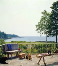  ??  ?? BOTTOM Off the master bedroom, an elevated bit of land provides space for a small patio with an enormous view.