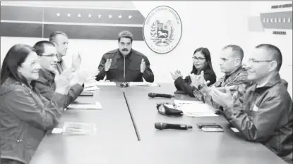  ??  ?? Venezuela’s President Nicolas Maduro (C) speaks during a meeting with government members at the Miraflores Palace in Caracas, Venezuela October 15, 2017. Miraflores Palace/Handout via REUTERS