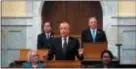  ?? MEL EVANS FILE — THE ASSOCIATED PRESS ?? As New Jersey Assembly Speaker Craig J. Coughlin, back left, D-Woodbridge, N.J., and Senate President Steve Sweeney, back right, D-West Deptford, N.J., listen as New Jersey Gov. Phil Murphy, center, addresses a gathering as he unveils his 2019 budget.