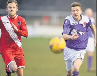  ??  ?? Atherstone’s Danny Harris and Hinckley’s Lee Butler racing for the ball. Hinckley lost 3-0, see inside for match report. Picture: Matt Buchan