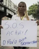  ?? ?? Underwear saleswoman Luciana Rodrigues protests against the closure of the openair market. Photograph: Alan Lima/The Observer