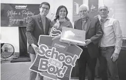  ?? ?? SUBWAY Philippine­s Marketing Manager Joshua Wahiman and Territory Manager Jean Gagarino receive the “School In A Box” system from Partner E-DRIS Inc. represente­d by Atty. Rainier Butalid and Syed Darwish Bederi III of Critical Links.