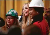  ?? Tom Brenner / New York Times ?? Workers have their photo taken with Ivanka Trump at an event marking the president’s executive order.