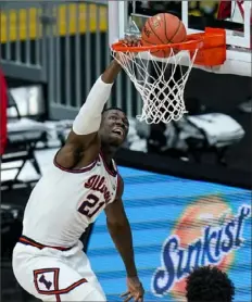  ?? Associated Press ?? Kofi Cockburn is one of the most powerful big men in NCAA Division I and a key factor in the resurgence of Illinois.