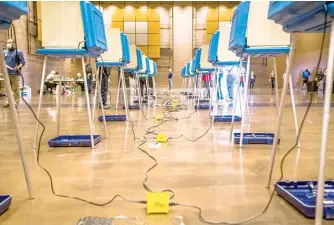  ??  ?? Voters cast their ballots on Nov. 3, 2020, inside the Century Center in South Bend, Indiana.