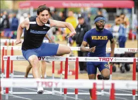  ?? MARC PENDLETON / STAFF ?? Miamisburg senior Colin Dillon (left) is having a strong year. He is shown running the 110-meter high hurdles on May 10 at the GWOC track and field meet at Troy’s Memorial Stadium.