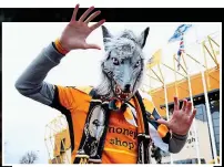  ?? EMPICS ?? Scary: a Wolves fan shows his bite