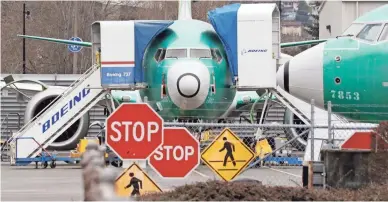  ?? ELAINE THOMPSON/AP ?? Boeing 737 MAX jets sit parked Monday at the airplane builder’s facility in Renton, Wash.