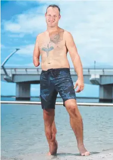  ?? Picture: RICHARD GOSLING ?? Lindsay Mills lost his right hand and injured his right leg in a motorcycle accident 20 years ago but it's not going to stop him tackling the Burleigh Swim Run today.