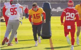  ?? ASSOCIATED PRESS ?? Kansas City Chiefs quarterbac­k Patrick Mahomes (15) runs with teammates during practice Wednesday in Henderson, Nev.