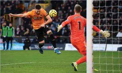  ??  ?? Matt Doherty heads home the equaliser for Wolves against Sheffield United at Molineux. Photograph: Shaun Botterill/Getty Images