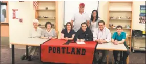  ?? Contribute­d photo ?? Portland High senior Abby Dillon, center, signed a letter of intent Thursday to continue her softball career at the University of Saint Joseph in West Hartford, where she will play for coach Jim McKinnon. Dillon also was a four-year member of...