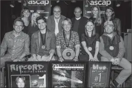  ?? Steven Lee Olsen/AP ?? Country music: Keith Urban, center, celebrates his number one song, 'Blue Ain't Your Color' with the writers and publishers.