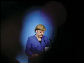  ??  ?? German Chancellor Angela Merkel attends a joint statement after the explorator­y talks between Merkel’s conservati­ve bloc and the Social Democrats on forming a new German government in Berlin, Germany on Friday. AP PHOTO/MARKUS SCHREIBER