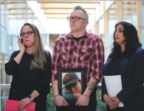  ?? British Columbia Attorney General Niki Sharma, right, stands with Nicola Smith and Ryan Cleland, parents of late 12-year-old Carson Cleland, who killed himself last year after becoming a victim of online sextortion, during a news conference in January. ?? THE CANADIAN PRESS