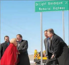  ?? SUBMITTED PHOTO - EAST PENN ?? Helen Breidegam, next to son Dan, admires the new sign in honor of her late husband DeLight Breidegam Jr. State Representa­tives Ryan Mackenzie, Mark Gillen, and David Maloney help commemorat­e this meaningful highway designatio­n.