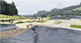  ?? PHOTOS: GREGOR RICHARDSON ?? Busy work . . . The new BMX track at Forrester Park is all set for a big meet next month. Right: Dunedin BMX club volunteer Wayne Gill rakes the track surface on Saturday in preparatio­n for the South Island Championsh­ips next month.