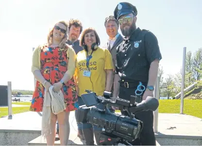  ??  ?? Sense Scotland’s Adele Bonehill, Andy Crossan, Liz Hamilton, Bill Wood and Birrell Pitcaithly, get into the film star spirit by shooting a promotiona­l video for the Festival of Fun.