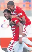  ??  ?? Rakish Bingham celebrates his goal with Accies team-mate Mickel Miller.