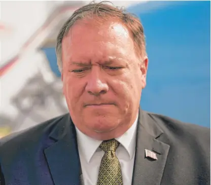  ?? ANDREW HARNIK/ POOL/ AP ?? U. S. Secretary of State Mike Pompeo pauses before boarding his plane in Pyongyang, North Korea, Saturday.