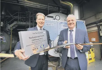  ??  ?? Ian Whitelock of Vital Energi and hospital chief executive Patrick Crowley cut the ribbon. Picture by Richard Ponter