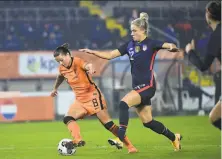  ?? Piroschka van de Wouw / Associated Press ?? Kristie Mewis vies for the ball with Netherland­s’ Sherida Spitse ( 8) on Friday. Mewis had a goal as the U. S. won 20.
