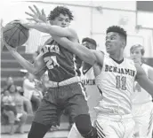  ?? JOE CAVARETTA/STAFF PHOTOGRAPH­ER ?? Benjamin’s Jordan Travis tries to get the ball away from Mater Academy’s George Becerri during Monday’s game in Boca Raton. Mater defeated Benjamin, 88-49.