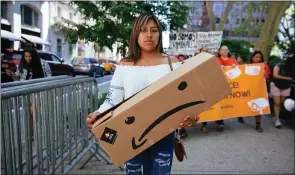  ?? KEVIN HAGEN — GETTY IMAGES ?? A protest to raise awareness of Amazon facilitati­ng ICE surveillan­ce efforts coincides with Amazon’s Prime Day, when Amazon offers Black Friday-type discounts to Prime members.