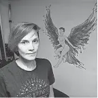  ?? ?? Rori Zura, 36, once had a video removed because of artwor k in the background, which was a nude illustrati­on of Zura as a survivor, wearing wings of fire.