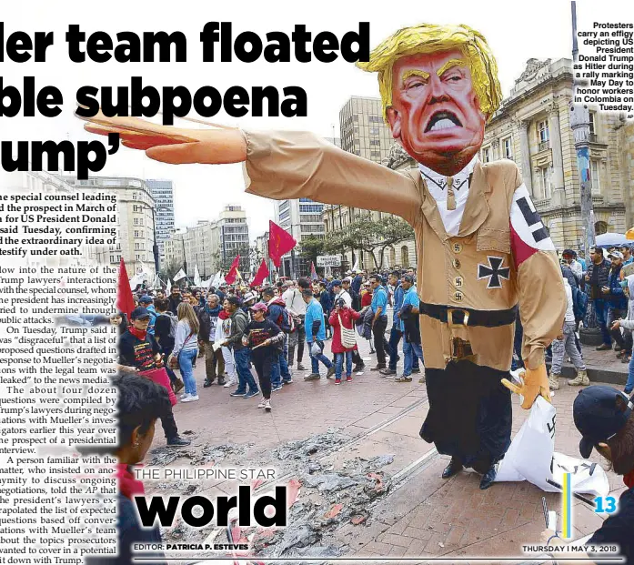  ??  ?? Protesters carry an effigy depicting US President Donald Trump as Hitler during a rally marking May Day to honor workers in Colombia on Tuesday.