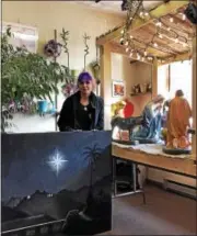  ?? NICHOLAS BUONANNO — NBUONANNO@TROYRECORD.COM ?? Local artist Nina Stanley stands with the background image that she designed, which will be displayed as the backdrop for the Nativity scene.