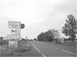  ?? CHARLES MCQUILLAN/GETTY ?? A defaced sign is seen this week at the border of Northern Ireland and Ireland.