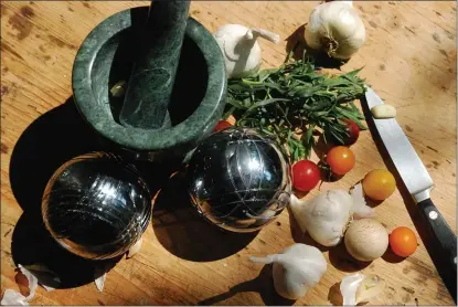  ?? NANCY LINDAHL/CONTRIBUTE­D PHOTOS ?? Boules and garlic are part of prepping for Le Grand Aioli.