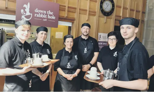  ?? ?? Students from Thornhill Park School and staff at Sunderland Minster new cafe called Down the Rabbit Hole in partnershi­p with North East Autism Society.