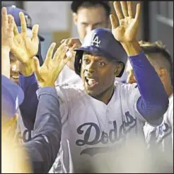  ?? LA TIMES ?? Curtis Granderson has pinch hit and run scored in Dodger win that gives L.A. 2-0 lead over Arizona Diamondbac­ks in NLDS.