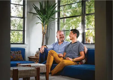  ?? Mark Mulligan / Staff photograph­er ?? Kendall Satcher, left, and Ben Nguyen planned to marry this summer at their home in Houston’s Sixth Ward. When the pandemic canceled their plans, they traveled to Galveston Island to receive a marriage license.