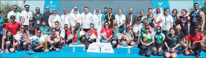  ?? ?? Officials and winners of the West Asian Triathlon Championsh­ip pose for a group photo.