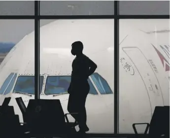  ?? CHARLIE RIEDEL/AP FILE ?? An air traveler at Hartsfield-Jackson Internatio­nal Airport in Atlanta.