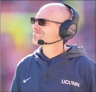  ?? Jacob Kupferman / Getty Images ?? UConn coach Lou Spanos looks on against Clemson during a game on Nov. 13.