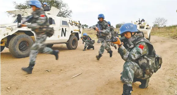  ?? Photo: ?? Chinese peacekeepe­rs to South Sudan in a training session in this file photo taken on January 4, 2019.
Xinhua