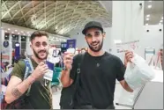  ?? PROVIDED TO CHINA DAILY ?? Passengers show their air tickets at Chengdu Shuangliu Airport in late September, when the airport launches its first direct flight to Tel Aviv, Israel.