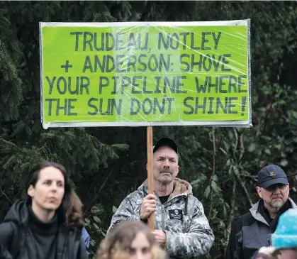  ?? DARRYL DYCK/THE CANADIAN PRESS ?? A man expresses his sentiments with a sign as protesters opposed to the Kinder Morgan Trans Mountain pipeline extension defy a court order and block an entrance to the company’s property in Burnaby on Saturday.