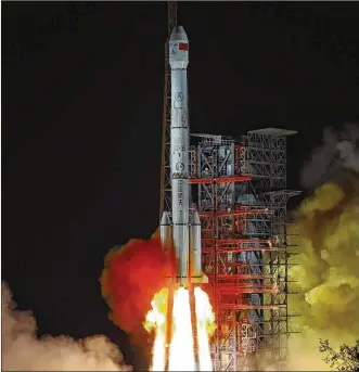  ?? ASSOCIATED PRESS ?? The Chang’e 4 lunar probe launches from the Xichang Satellite Launch Center in southweste­rn China’s Sichuan province on its way to making the first landing on the far side of the moon. The Chinese satellite captured stunning backside images of the moon with Earth.
