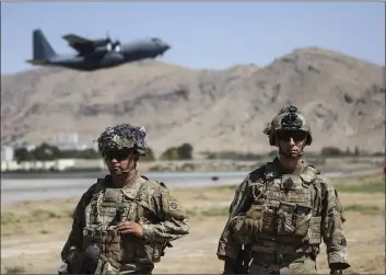  ?? DEPARTMENT OF DEFENSE ?? Two U.S. paratroope­rs assigned to the 1st Brigade Combat Team, 82nd Airborne Division, stand guard while a C-130 Hercules takes off in Kabul, Afghanista­n, Wednesday.