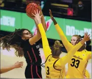  ??  ?? Stanford’s Haley Jones, a Santa Cruz native, shoots against Cal’s Fatou Samb (33) and Dalayah Daniels (3) during the first half on Sunday.