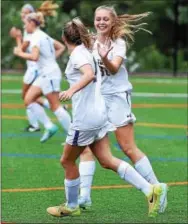  ?? PETE BANNAN-DIGITAL FIRST MEDIA ?? Downingtow­n East’s Maddie Eckels and Rebekah March celebrate March’s first half goal against Oxford Wednesday.