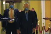  ?? SUSAN WALSH — THE ASSOCIATED PRESS ?? On Dec. 15, Senate Majority Leader Mitch McConnell of Kentucky walks past reporters on Capitol Hill in Washington.