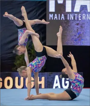  ??  ?? Aoife Power, Alice Molloy-Nolan & Aoife Gough during their somersault routine.